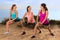 Casual conversation athletes stretching in exercise class outdoors before jog and hike on trail path