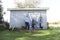 Casual cool family poses against shed