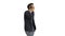 Casual man talking on mobile phone while walking on white background.