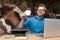 Casual man working on laptop raising a cup of coffee