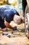 Casual man working under car fixing something