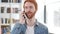 Casual Redhead Man Talking on Phone