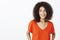 Casual talk with friend keep mind relaxed. Positive attractive african-american woman with afro hairstyle in t-shirt