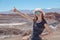 Casual woman enjoy solo trip and admire unique epic landscape of the Moon Valley, Chile