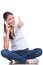 Casual woman sits & thumb up on phone