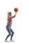 Casual young woman shooting a basketball