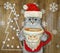 Cat ashen in Santa hat drinks coffee 3