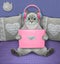 Cat ashen works with pink laptop in bed 2