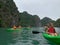 Cat Ba, Vietnam - November 19, 2019 : Group of tourist kayak near Ha Long Bay