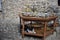 The cat chilling out under the table  with the oriental fashioned silverwork,copperwork items