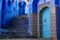 Cat climbing stairs in Chefchaouen