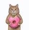 Cat holds bitten pink donut