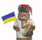 Cat holds a flag and a sack of hryvnia