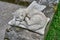 A cat made of stone sleeping