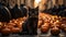 A cat sitting in front of pumpkins on street