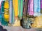 Cat washing among moroccan scarfs with traditional ornaments in Essaouira, Morocco