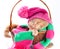 Cat wearing a pink knitting hat with pompom and a scarf
