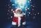 Cat wearing Santa Claus costume on Christmas glittering lights