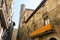 Catalan flag, hanging on a balcony, in the Gothic Quarter of Bar