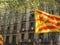 Catalan independence flag with a historical building at the background