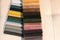 Catalog of multi-colored fabric samples. Textile industry background.