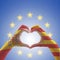 Catalonia Estelada flag  and Spain flag on Catalunya people`s heart-shape hands or Catalonia- Spanish unity supporter on EU