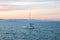 The catamaran against the evening sea and mountains