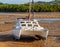 Catamaran Beached In The Mud At Low Tide