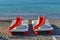 Catamaran boats with slide on a sea coast on a sunny day