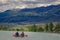 Catamaran on the Chuya river against the backdrop of an impressive mountain range in the Altai Krai