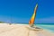 Catamaran with colorful sails on a tropical beach in Cuba