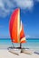 Catamaran with its colorful sails wide open