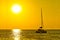 Catamaran sailboat on golden sunset