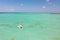 Catamaran sailing boat in turquoise sea lagoon on tropial Mauritius island. Aerial, drone view.