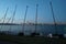 Catamaran sailing boats against Perth central business district skyline at sunset