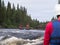 Catamaran sailing with a group of rowers on the river