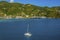 A catamaran sails gracefully towards Road Town Marina in Tortola