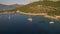 Catamaran and yachts in the sea near Greek island