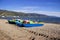 Catamarans boats on a sandy beach in the town of Pogradec against the backdrop of Lake Ohrid