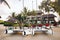 Catamarans with sails are parked on the beach in front of a villa on the tropical island of Mauritius