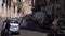 CATANIA, SICILY, ITALY - SEPT, 2019: Blurred motion, narrow busy street. Old buildings. Parked and moving cars. Walking