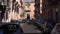 CATANIA, SICILY, ITALY - SEPT, 2019: Narrow street of historic center. Old buildings with balconies. Parked, moving cars