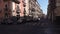 CATANIA, SICILY, ITALY - SEPT, 2019: Street, old buildings with balconies. Parked and moving cars, motorcycles passing