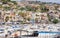 Catania, Sicily, Italy â€“ august 08, 2018: View of Acitrezza port with fisher boats next to Cyclops islands, beautiful cityscape