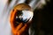 Catching the beautiful atmosphere of Ko Lanta, Thailand. Close up of female hand holding crystal glass ball. Reflection of beach
