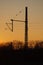 A catenary mast in the sunset