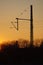 A catenary mast in the sunset