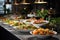 Catering buffet food on a long table in a hotel restaurant