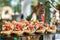 Catering buffet table with snacks and appetizers. Set of canapés with jamon, bruschetta and cheese
