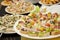 Catering, food service closeup, plates full of fresh tasty food and appetizers, company banquet concept, smorgasbord
